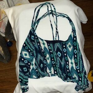 BUNDLE 3 for $5 or 7 for $EUC LOOSE HALF TOP WITH STRAPS THAT CROSS IN BACK🤩